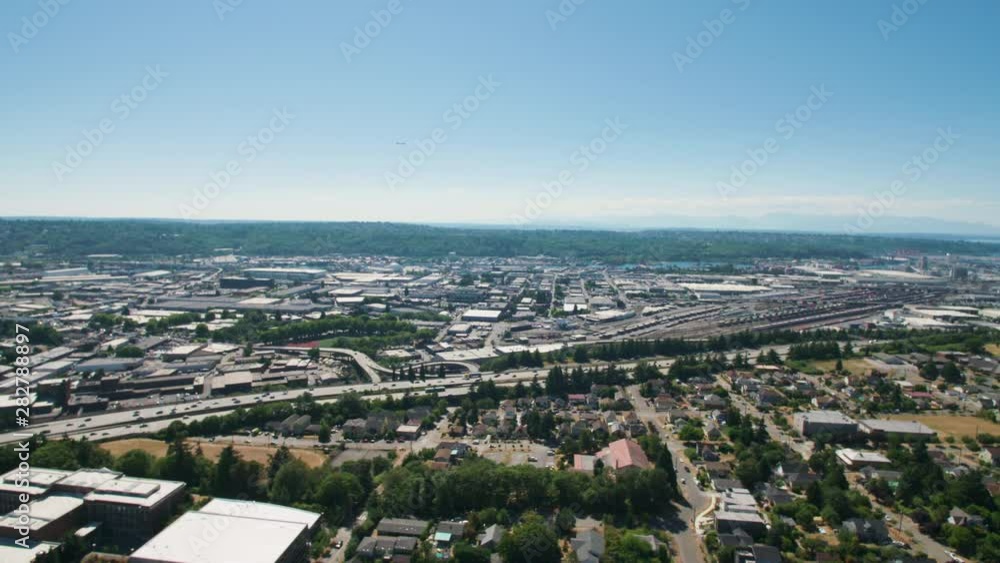 Plane Flying Above South Seattle City Industrial Area Georgetown Neighborhood Plane Flying Above South Seattle City Industrial Area Georgetown Neighborhood