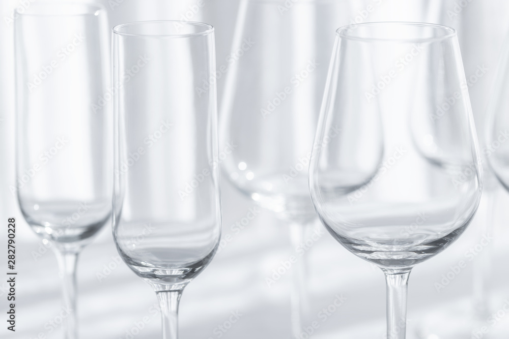 Several glasses for different kind of wine on the white tablecloth. Abstract background. Several glasses for different kind of wine on the white tablecloth. Abstract background.