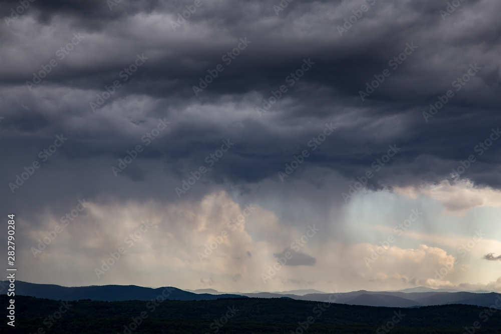 Dramatic Sky Background. Stormy Clouds in Dark Sky. Moody Cloudscape. Panoramic Image Can Be Used as Web Banner or Wide Site Header. Toned and Filtered Photo with Copy Space.