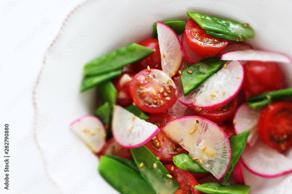 Vegetarian salad, radish and tomato sesame salad Vegetarian salad, radish and tomato sesame salad