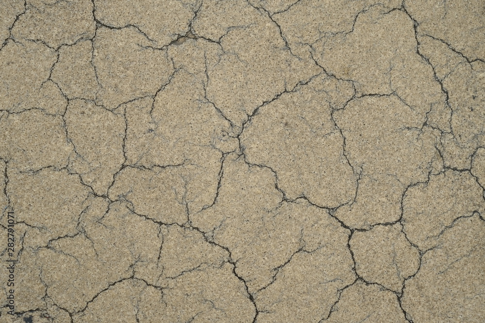 Cracks on the concrete surface of a house in Los Angeles Cracks on the concrete surface of a house in Los Angeles