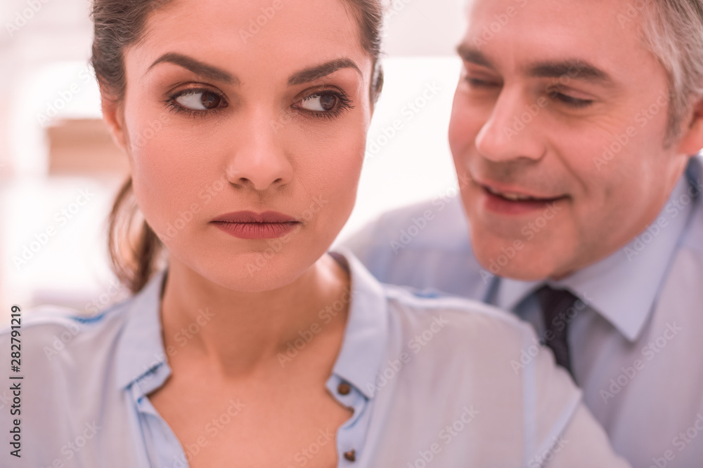 Young woman feels discriminated by her boss while working Young woman feels discriminated by her boss while working