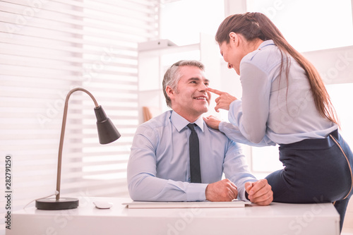 Принти на полотні Personal assistant and her boss flirting at the workplace
