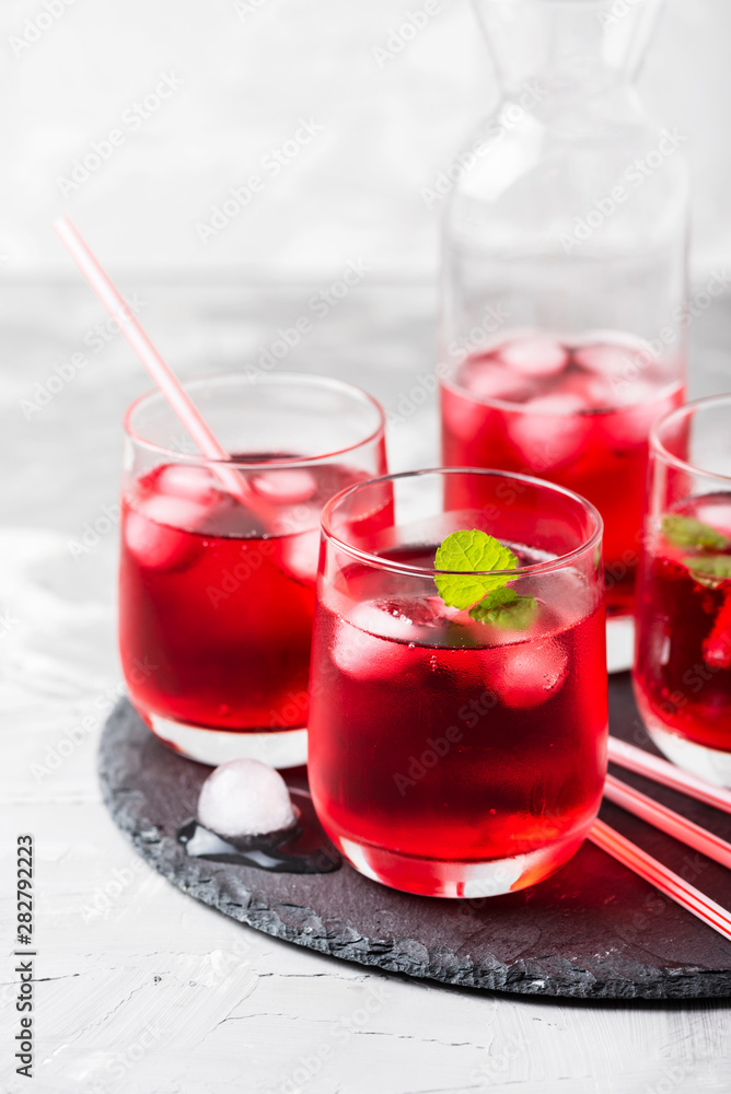 Red alcoholic coctail with ice and mint Red alcoholic coctail with ice and mint