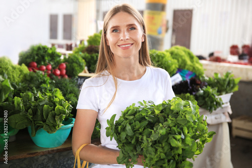 Woman with fresh mint at market