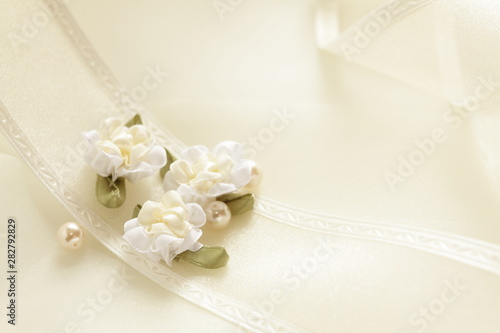 Elegant ribbon and artificial flower for background image
