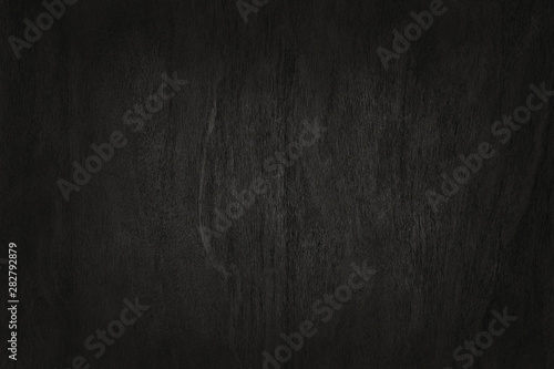 Black wooden wall background, texture of dark bark wood with old natural pattern for design art work, top view of grain timber.