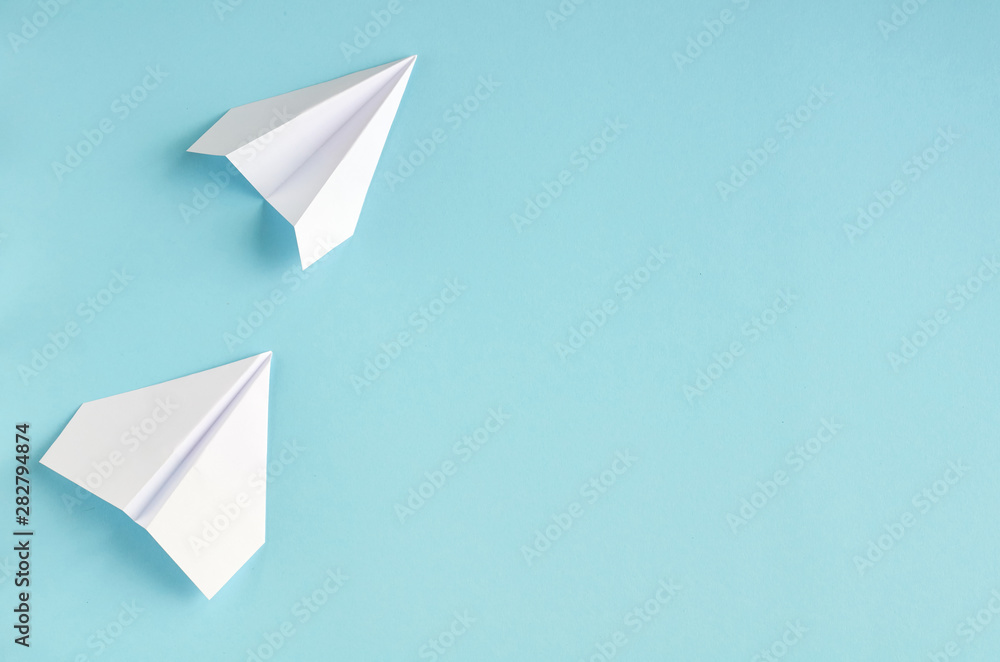 White paper planes on blue background composition. White paper planes on blue background composition.
