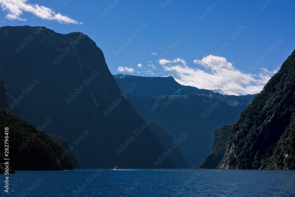 Scenic view on the Milford Sound from a boat cruise in new zealand. Milford Sound, New Zealand in sunset hours.Mysterious day in Milford Sounds.Milford Sound in Fiordland National Park in south island
