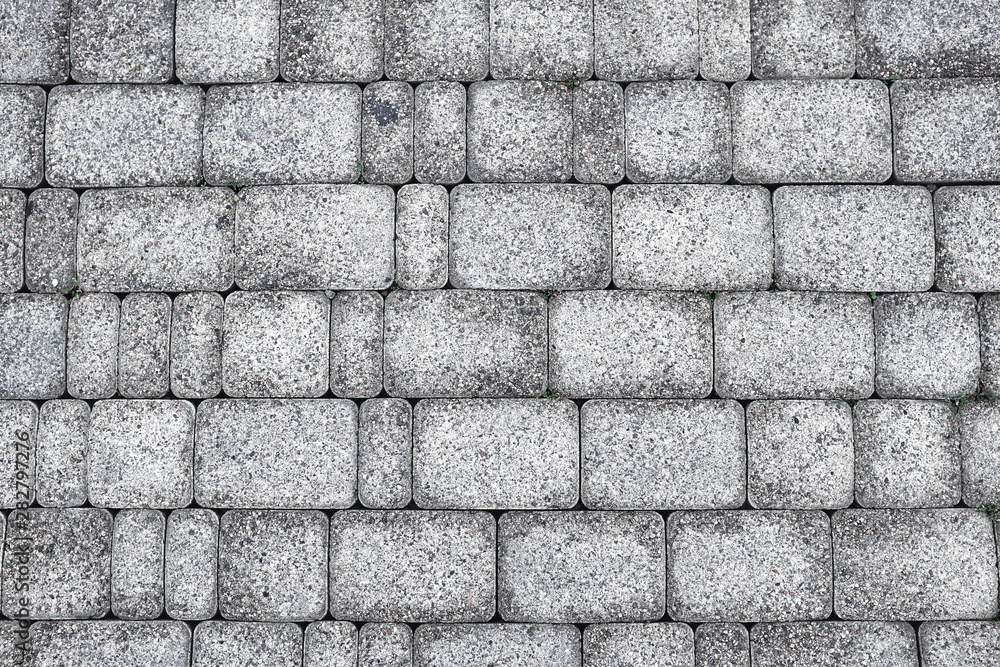 Stone pavement texture wet after rain. The texture of the road surface. Stone pavement texture wet after rain. The texture of the road surface.