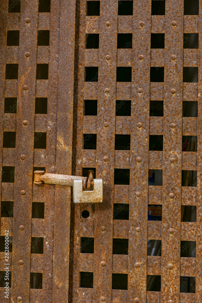 Syracuse, Sicily, Italy An old door and lock in Ortygia or the old town. Syracuse, Sicily, Italy An old door and lock in Ortygia or the old town.