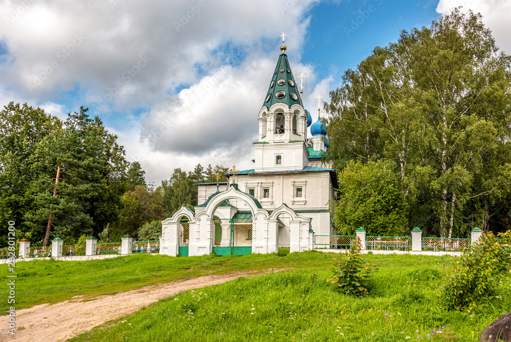 Rural cemetery and rural temple. Yaroslavl region, Russia