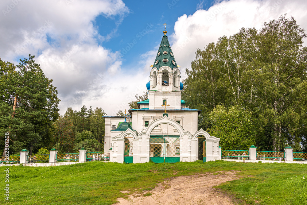 Rural cemetery and rural temple. Yaroslavl region, Russia