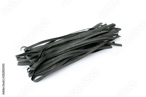 Close up of Linguine pasta Italian food in  black color isolated on white background with copy space. 