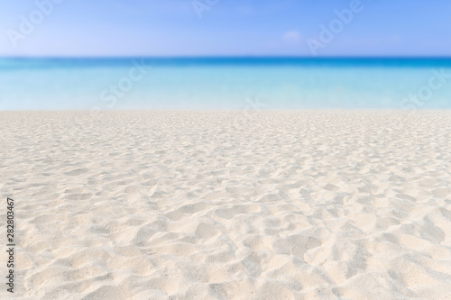 Sand on the beach and blue sky as background