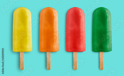 variety of fruits ice lolly on blue background