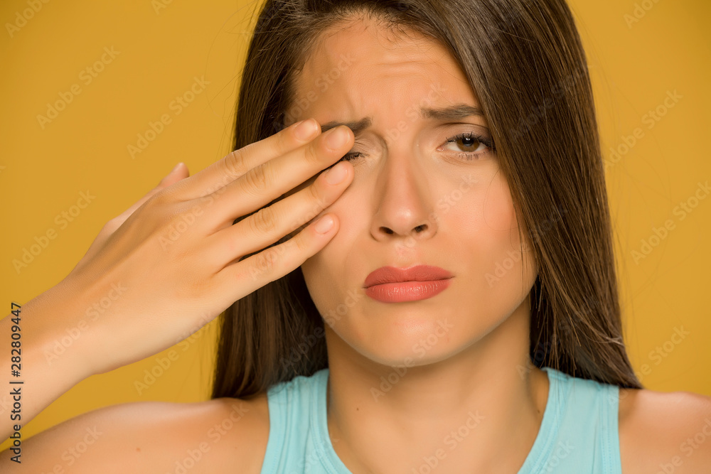 Young beautiful woman eye pain Young beautiful woman eye pain