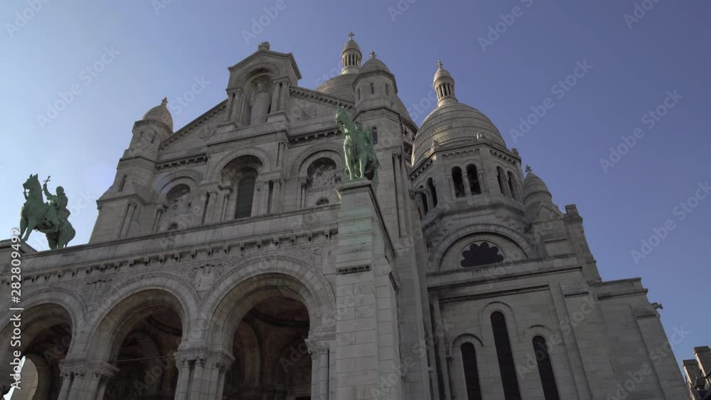 Left to right pan real time establishing shot of Sacre-Coeur Basilica. Temple in Paris Left to right pan real time establishing shot of Sacre-Coeur Basilica. Temple in Paris