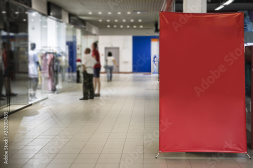 Blank red sign inside shopping mall