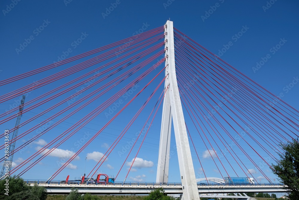 Fototapeta premium Cable-stayed bridge on the Vistula river. Cars passing the bridge. Gdansk/Poland