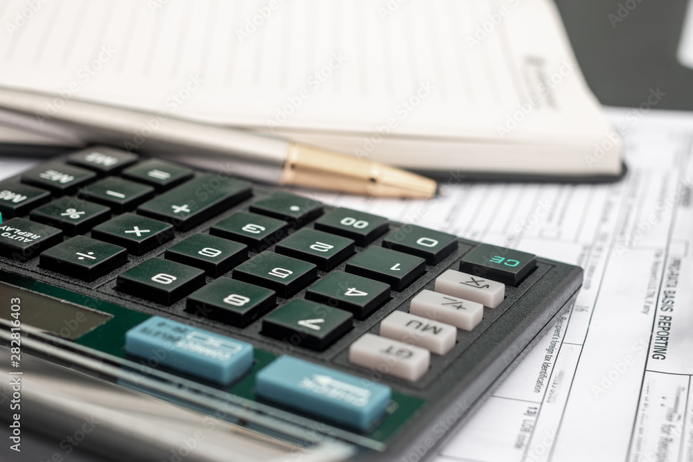 calculator and documents for working on the table, Finance and savings, Business concept. calculator and documents for working on the table, Finance and savings, Business concept.