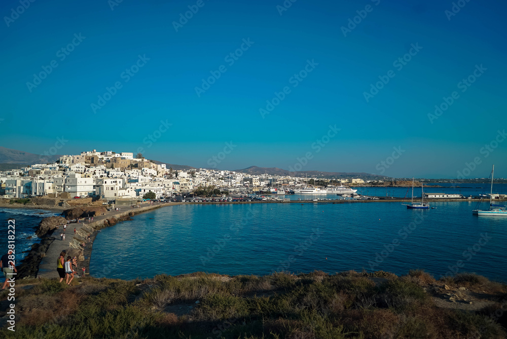 2 men playing bouzouki surrounded by the beauty of the island of Naxos