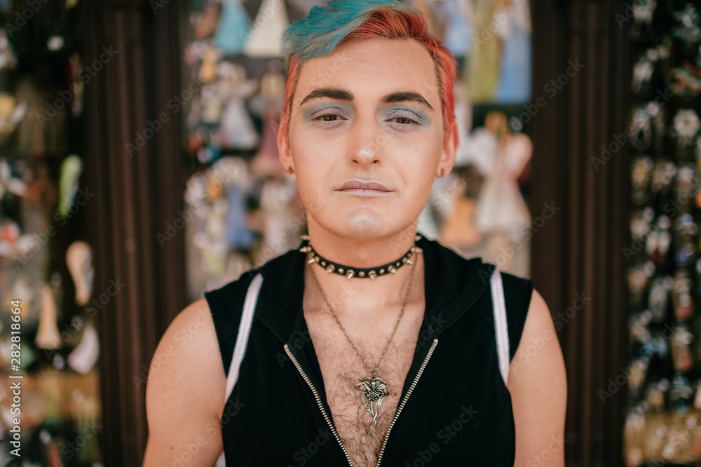 man with makeup transvestite portrait on abstract background.