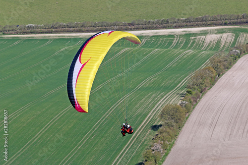 Tandem Paraglider flying at Combe Gibbet, England