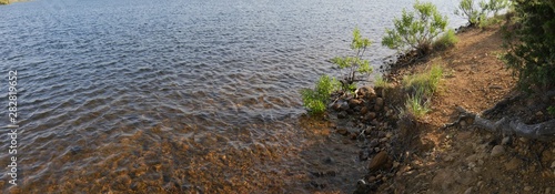 Panoramic close up of waters rippling toward the shore of Lake Elmer Thomas in Comanche County  Oklahoma.