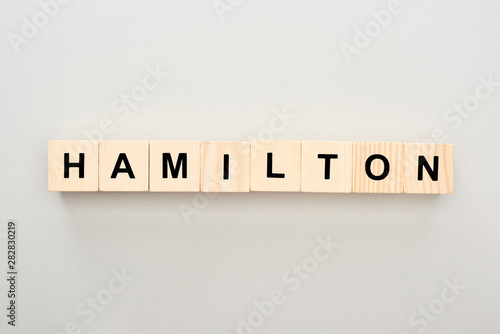 top view of wooden blocks with Hamilton lettering on grey background