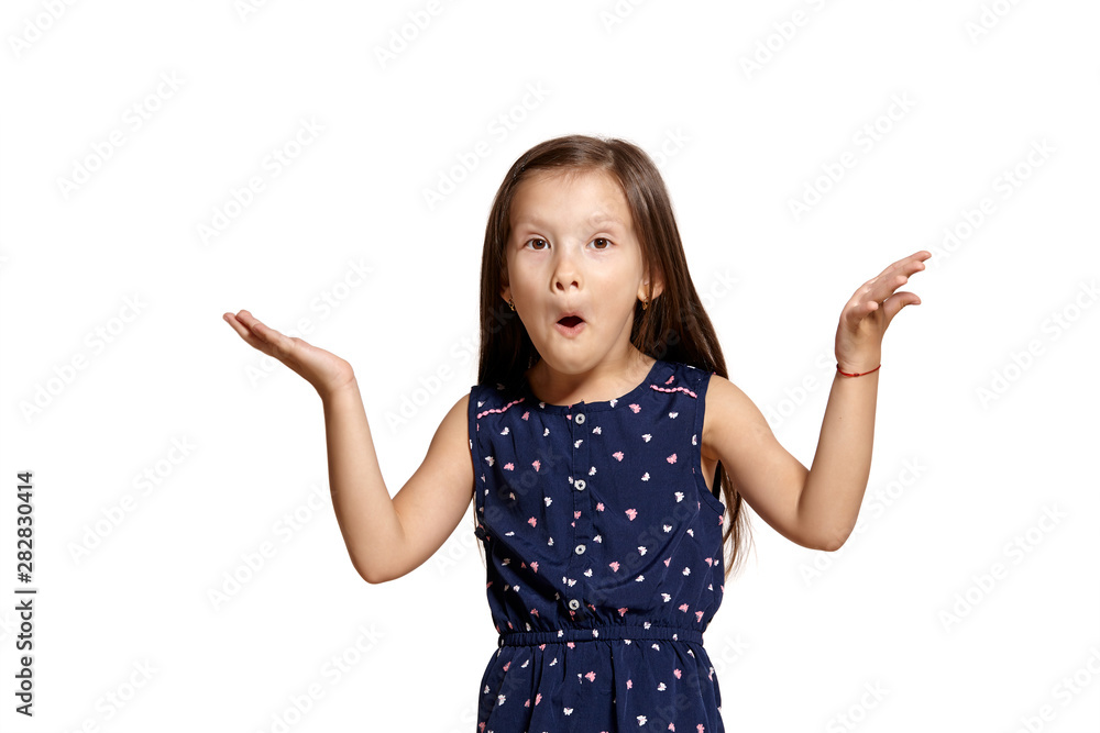Close-up studio shot of beautiful brunette little girl posing isolated on white studio background. Close-up studio shot of beautiful brunette little girl posing isolated on white studio background.