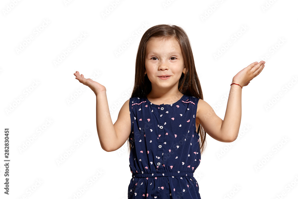Close-up studio shot of beautiful brunette little girl posing isolated on white studio background. Close-up studio shot of beautiful brunette little girl posing isolated on white studio background.