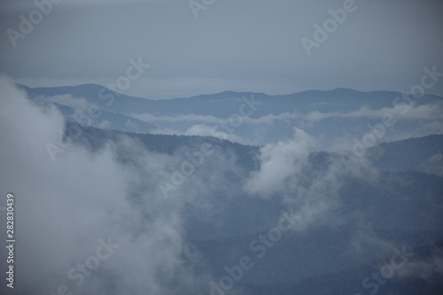 cloudy foggy morning in the mountains with beautiful panorama of the mountains