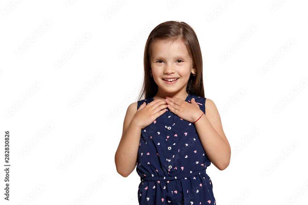 Close-up studio shot of beautiful brunette little girl posing isolated on white studio background. Close-up studio shot of beautiful brunette little girl posing isolated on white studio background.