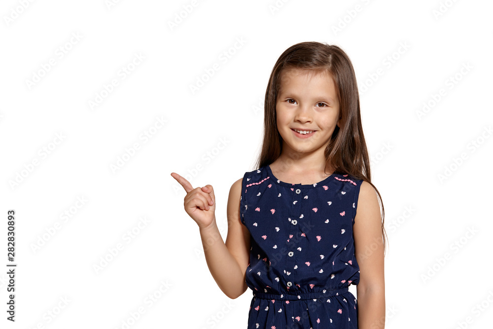 Close-up studio shot of beautiful brunette little girl posing isolated on white studio background. Close-up studio shot of beautiful brunette little girl posing isolated on white studio background.