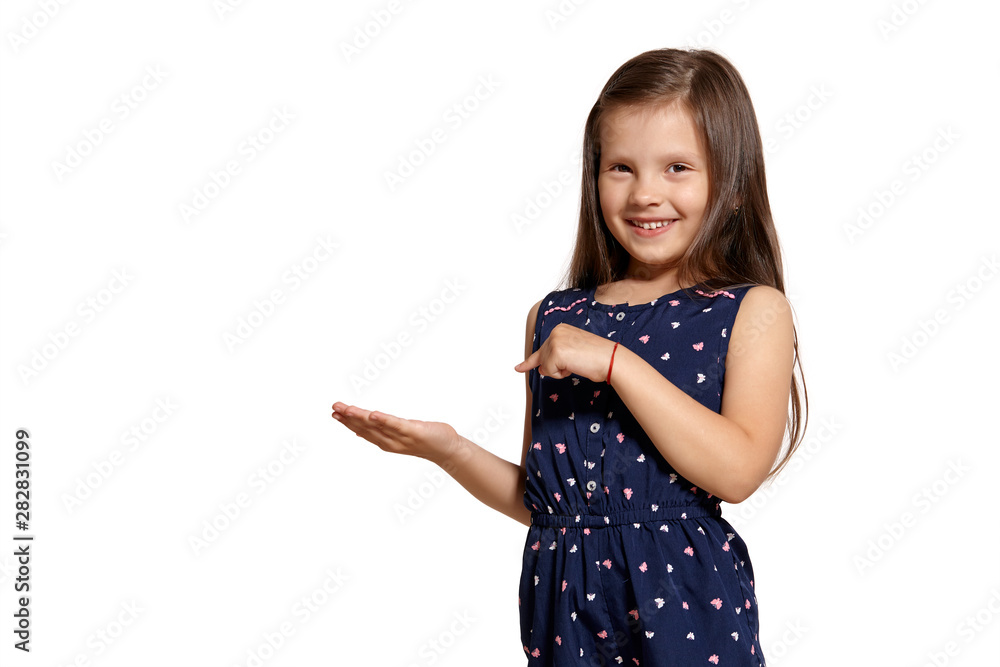 Close-up studio shot of beautiful brunette little girl posing isolated on white studio background. Close-up studio shot of beautiful brunette little girl posing isolated on white studio background.