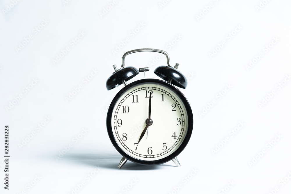 Black alarm clock isolated on white Black alarm clock isolated on white
