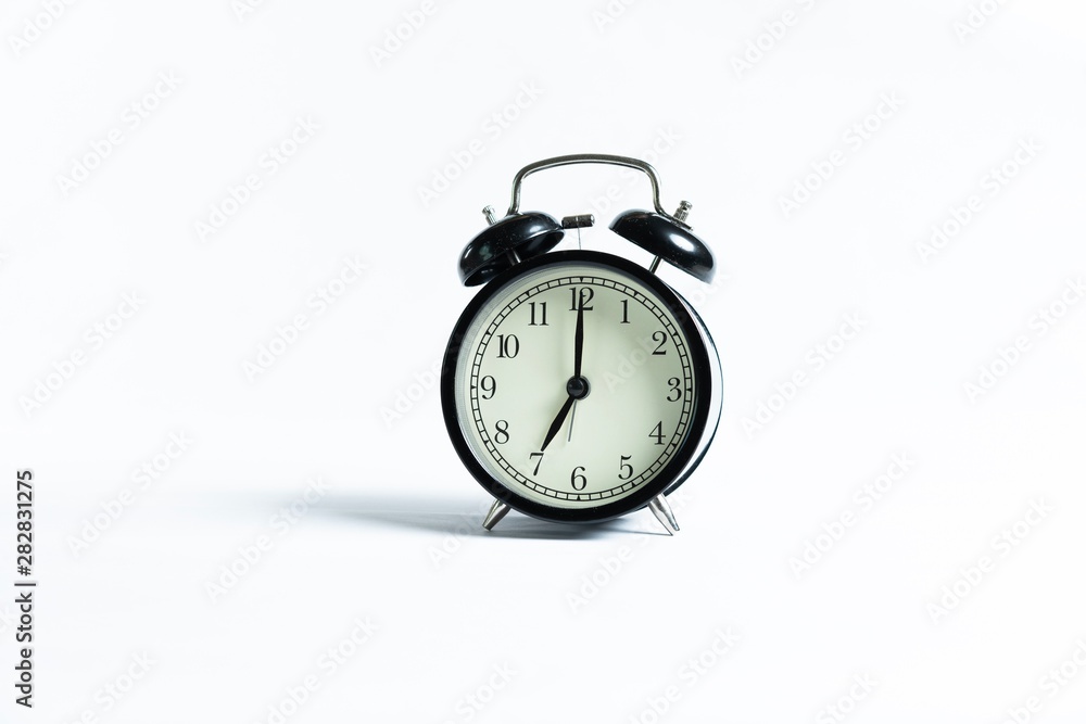 Black alarm clock isolated on white Black alarm clock isolated on white