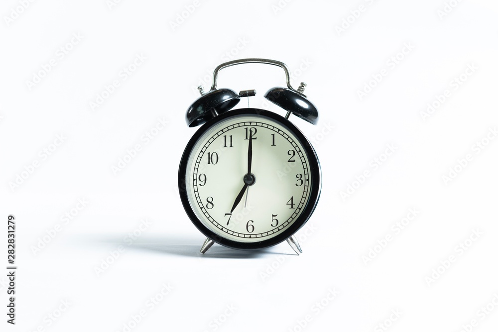 Black alarm clock isolated on white Black alarm clock isolated on white