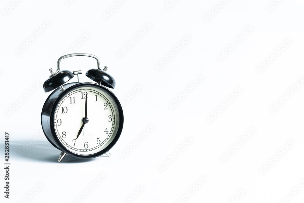 Black alarm clock isolated on white Black alarm clock isolated on white