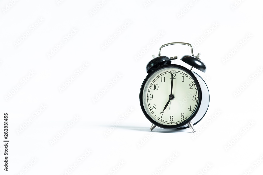 Black alarm clock isolated on white Black alarm clock isolated on white