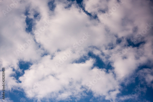 Thick white cloud on blue sky background.