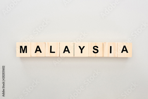 top view of wooden blocks with Malaysia lettering on white background