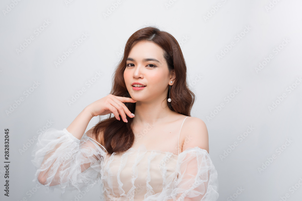 Smiling beautiful young woman face isolated on white Smiling beautiful young woman face isolated on white