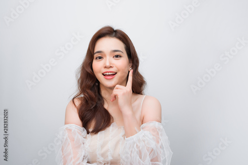 Attractive asian woman skin care image on white background