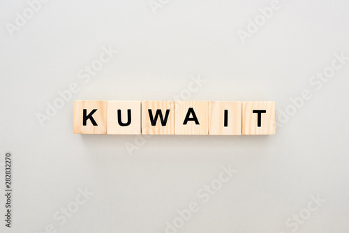 top view of wooden blocks with Kuwait lettering on white background
