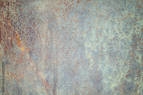 Dark worn rusty metal texture background. Vintage effect. © nikol85