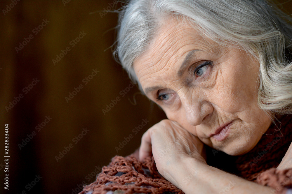 Close up portrait of cute sad senior woman Close up portrait of cute sad senior woman