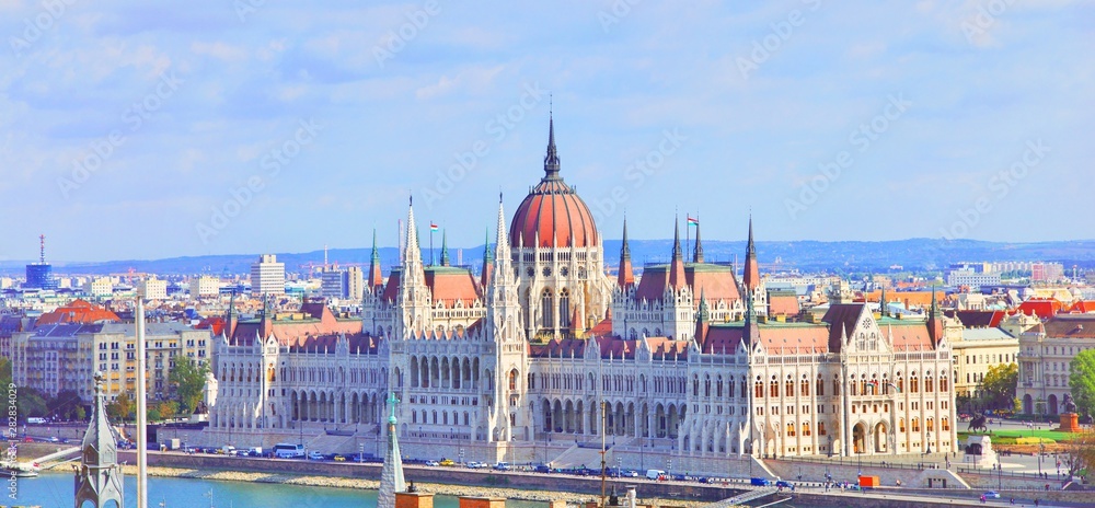 A landscape view of Budapest city at daytime, the Hungarian parliament building and other buildings along Danube river, Hungary. One of the most beautiful building in the Hungarian capital.