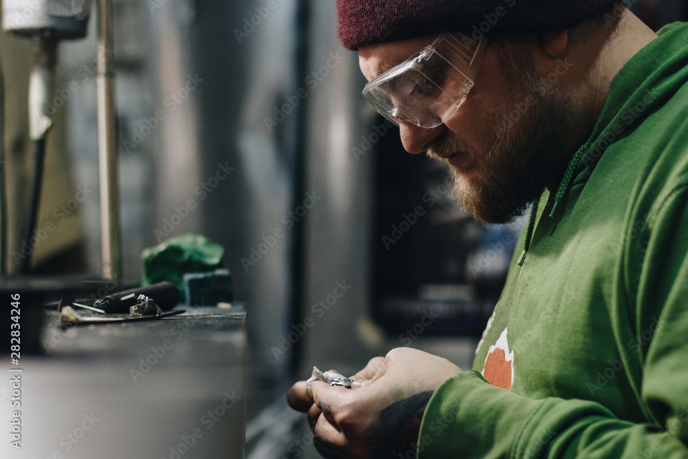Jeweler working at workshop Jeweler working at workshop
